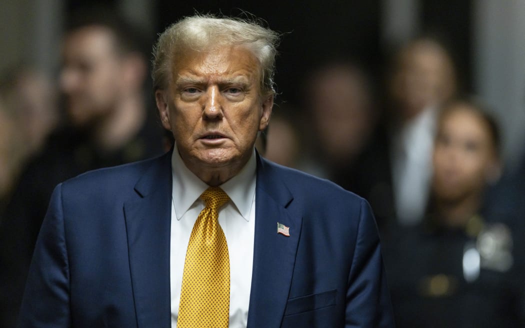 Former President Donald Trump prepares to talk to reporters outside the courtroom at the end of the day of his trial at Manhattan criminal court, Tuesday, May 14, 2024, in New York.