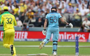 Ben Stokes is bowled by Mitchell Starc and kicks his bat during the Cricket World Cup 2019 match.