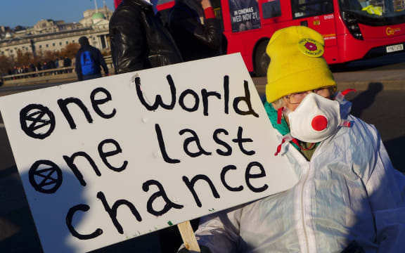 Climate activists gather in November, 2018 in London, blocking the traffic in a pacific protest, asking for the British Government to take action against climate change.