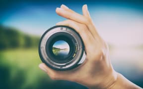 photography view camera photographer lens lense through video photo digital glass hand blurred focus people concept - stock image