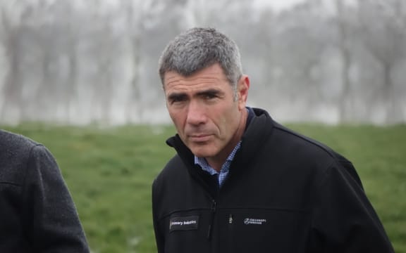 Minister for Primary Industries Nathan Guy on a farm visit as he announced support for flood-hit Otago farmers.