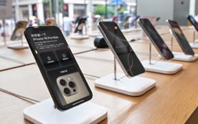 Iphone 16 Pro Max phones are seen on display at an Apple store in the Huangpu district in Shanghai, on June 23, 2025. (Photo by Hector RETAMAL / AFP)