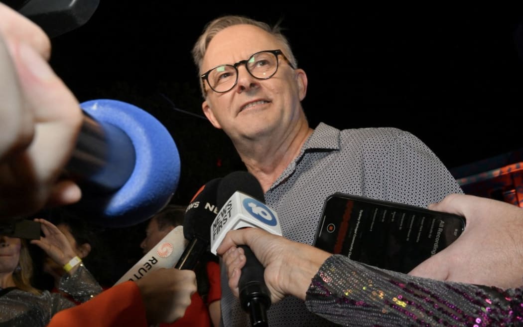 Australian Prime Minister Anthony Albanese talks to the media during the 45th Sydney Gay and Lesbian Mardi Gras Parade in Sydney on February 25, 2023. (Photo by Saeed KHAN / AFP)