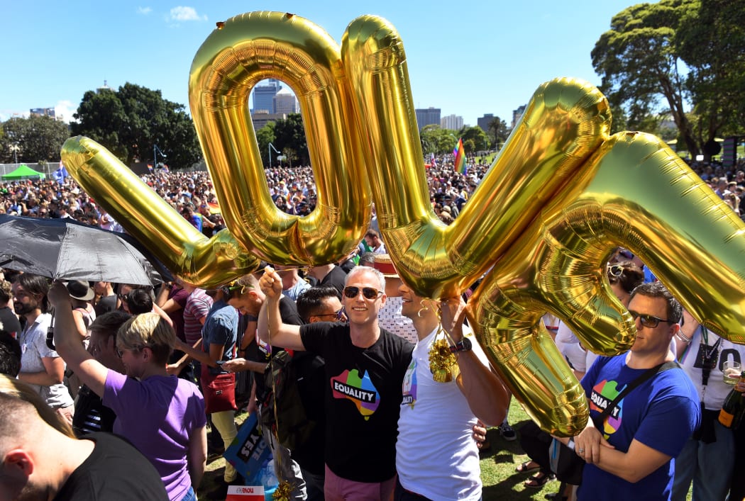 Supporters of the same-sex marriage "Yes" vote celebrate in a Sydney park shortly after the announcement.