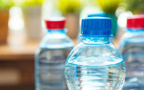 Full closed plastic water bottles. Close up