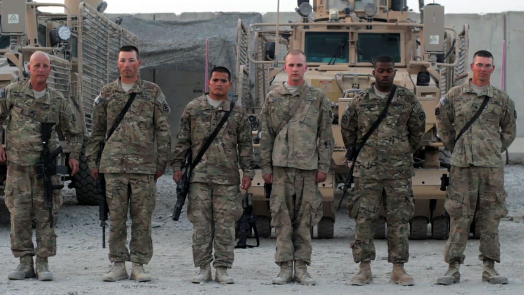 Micronesian soldier SGT Kilfrank Sigrah stands at attention in Kandahar, Afghanistan.