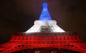 The Eiffel Tower illuminated with the colours of the French flag in tribute to the victims of the Paris's terror attacks.