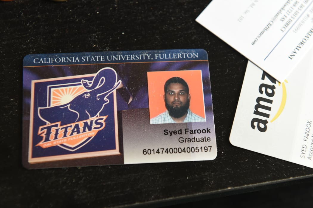 The California State University Fullerton student identification of San Bernardino mass murder suspect Syed Farook sits on a desk inside Farook's home