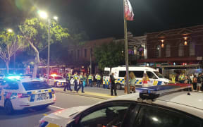 Police and paramedics along Wellington's Courtenay Place on a typically busy Saturday night.