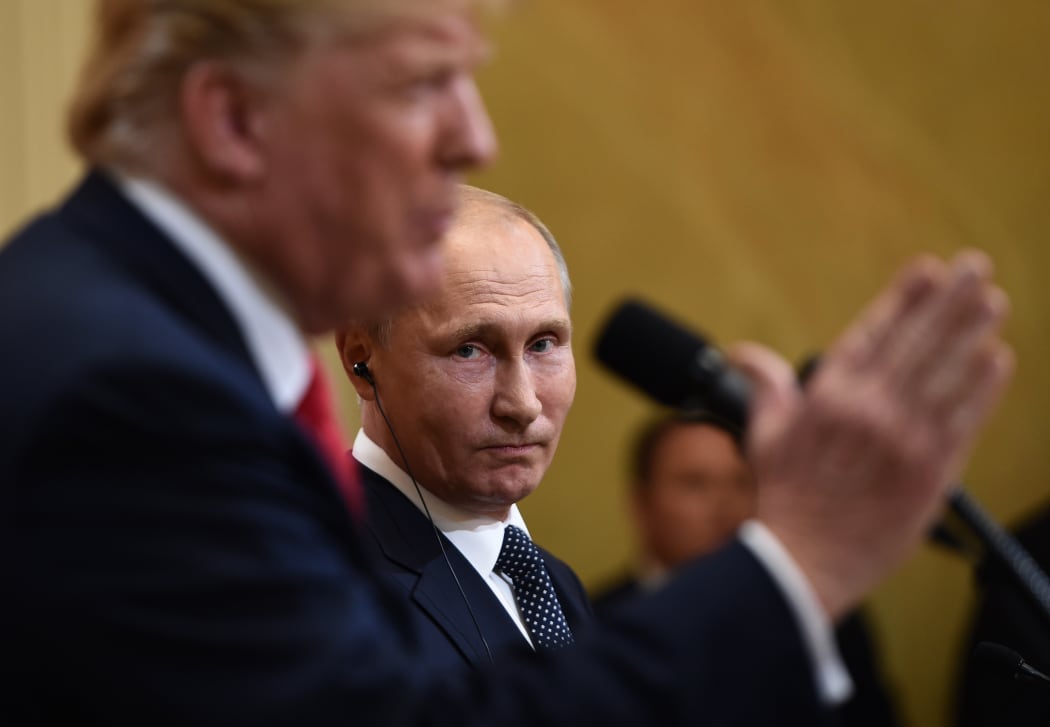 US President Donald Trump and Russia's President Vladimir Putin attend a joint press conference after a meeting at the Presidential Palace in Helsinki.
