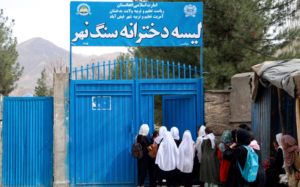 Afghan primary school girls arrive for their first class following the start of the new academic year, at a school in Fayzabad district, Badakhshan province on March 20, 2024. Schools in Afghanistan opened for the new academic year on March 20, the education ministry said, with girls banned from joining secondary-level classes for the third year in a row. (Photo by OMER ABRAR / AFP)