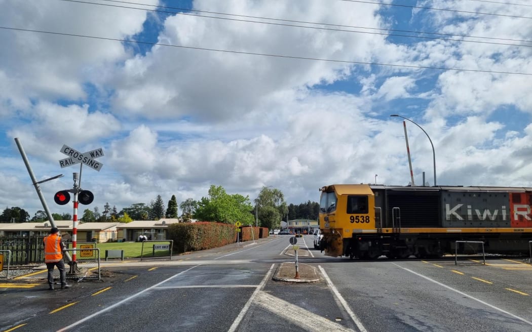 Officials at the site of a car vs train crash in Hamilton on 13 November 2024.