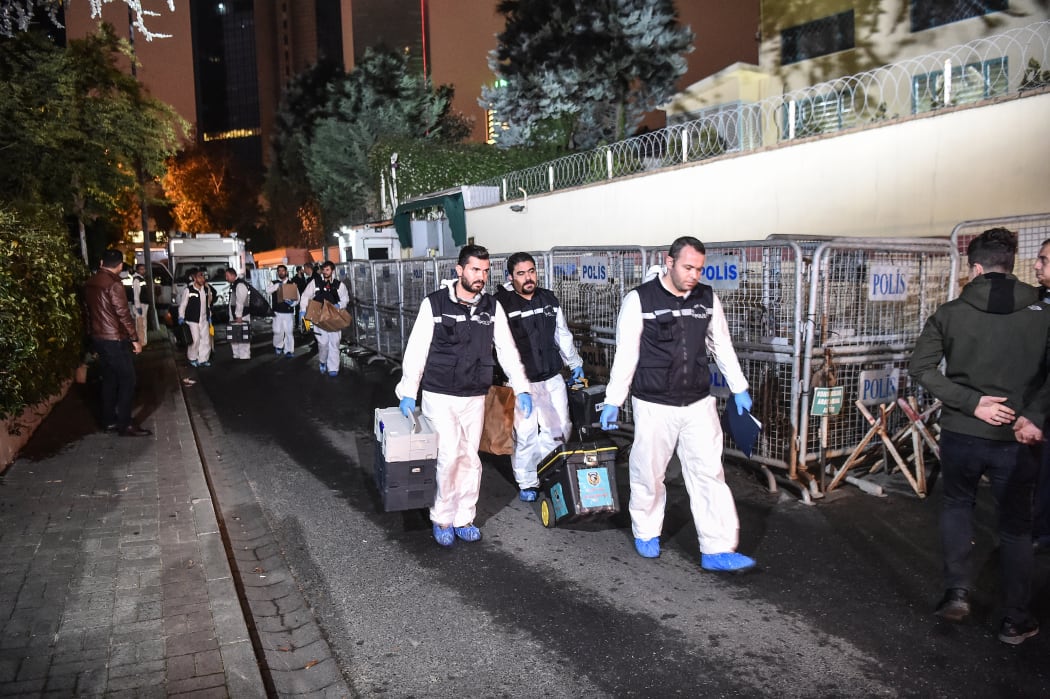 Turkish forensic police officers leave after gathering evidence at the Saudi Arabian consulate in Istanbul early on October 18.
