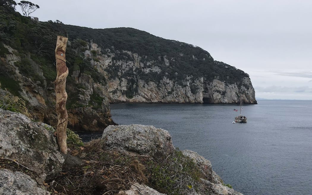 A carved pou whenua was concreted into the rock as a symbol of authority over the islands.
