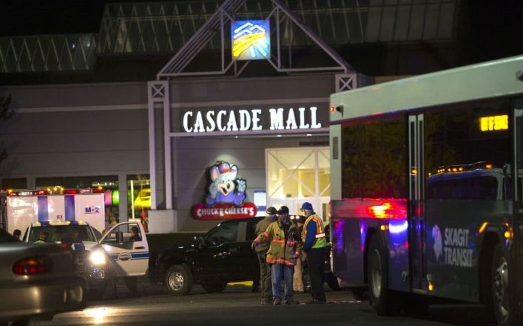 Police attend the Cascade Mall after three women were reportedly shot dead and a man critically injured following a shooting at the shopping center