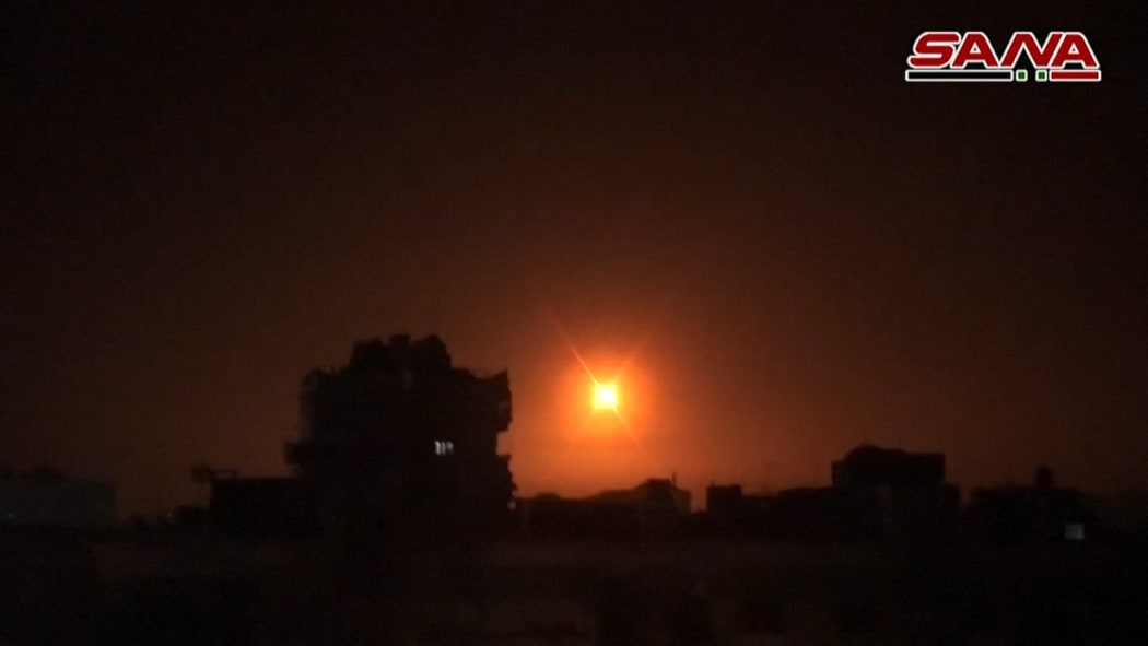 n image grab obtained from handout footage released by the official Syrian Arab News Agency (SANA) on February 14, 2020, reportedly shows footage of Syrian air defence firing into the sky.