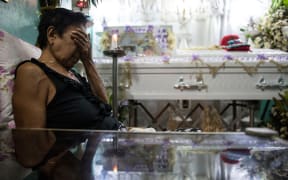 January 24, 2017: A relative at the wake of an alleged drug user killed by unidentified gunmen in Manila. Philippine police may have committed crimes against humanity by killing thousands of alleged drug offenders or paying others to murder as part of President Rodrigo Duterte's drug war.