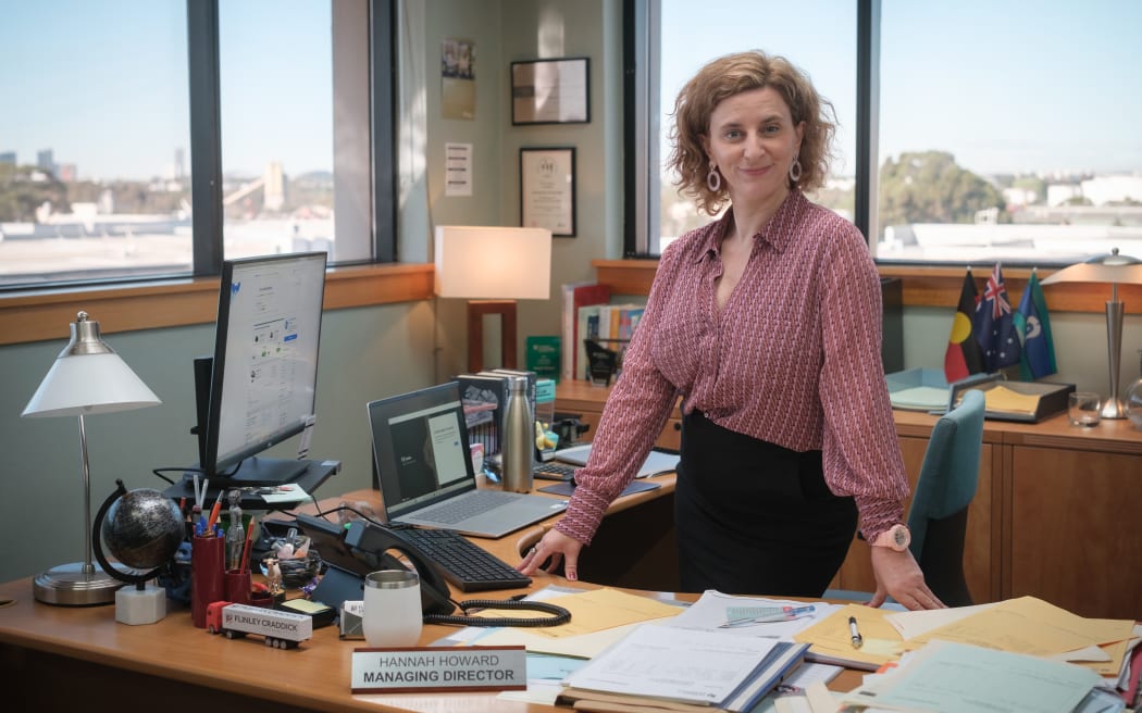 Hannah Howard (Felicity Ward) is hell-bent on keeping her "work family" together, even if it means lying about false orders to work from the office and subjecting everyone to TGIF Fridays.