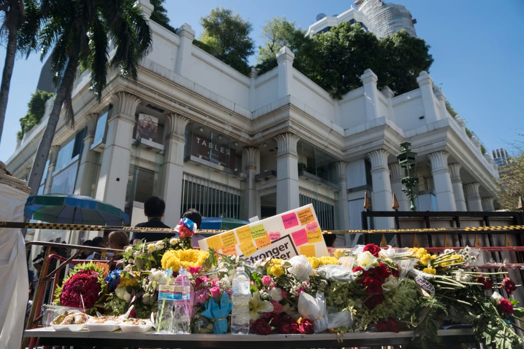 Flowers are laid at the entrance to the reopened Erawan Shrine in Bangkok.