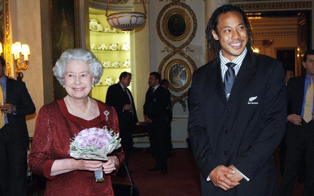 Queen Elizabeth II with Tana Umaga, then-All Blacks captain, during a special reception at Buckingham Palace in London in 2005