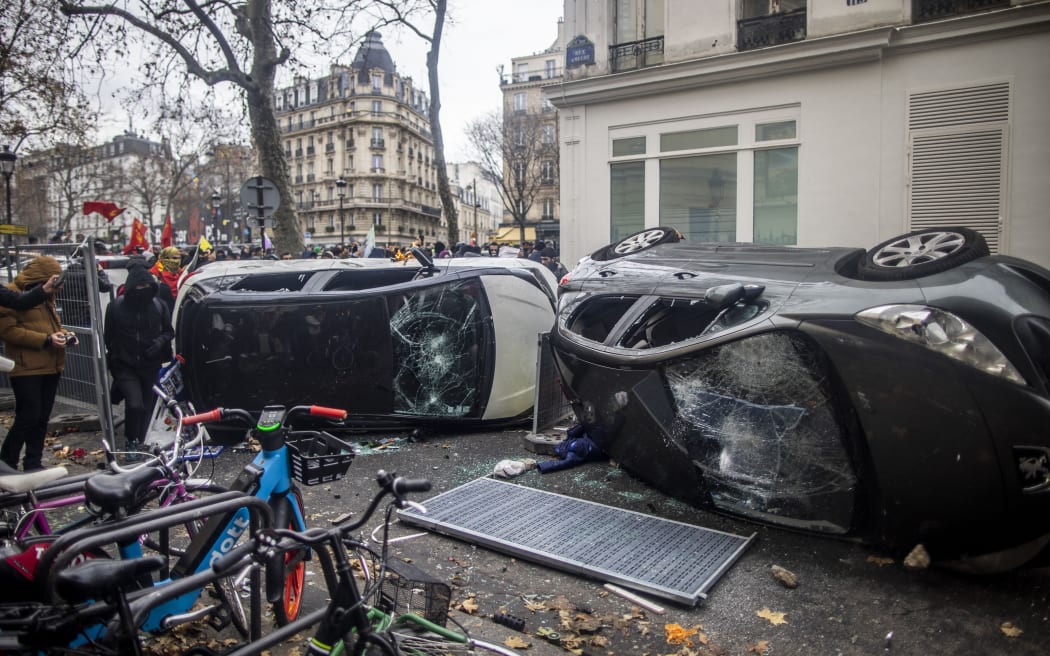 Protesters clash with police after a demonstration that was taking place in Place de la Republique in Paris, France on December 24, 2022.