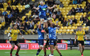 Blues Blake Gibson passes out the line out ball.