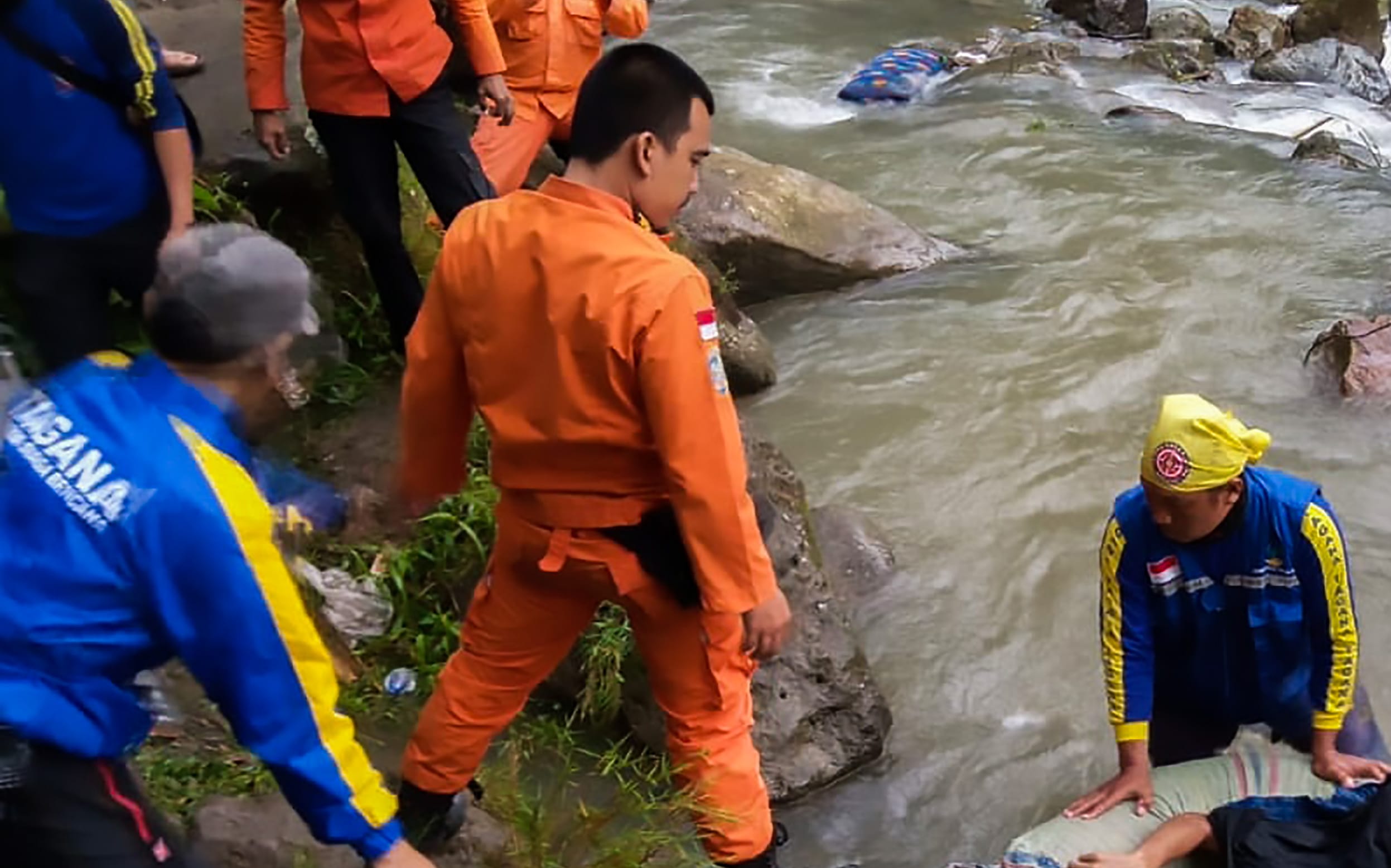 At least two dozen people died and 13 others were injured after a bus plunged into a ravine in Indonesia, police said.
