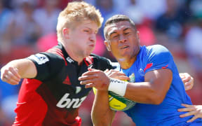 Lucky Palamo of Samoa (R) braces for impact with the Crusaders Jack Goodhue.