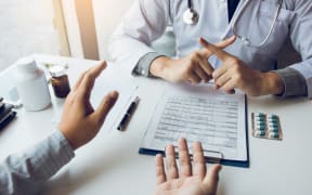 Doctor is talking about contraindications for treatment or taking medication for treatment.