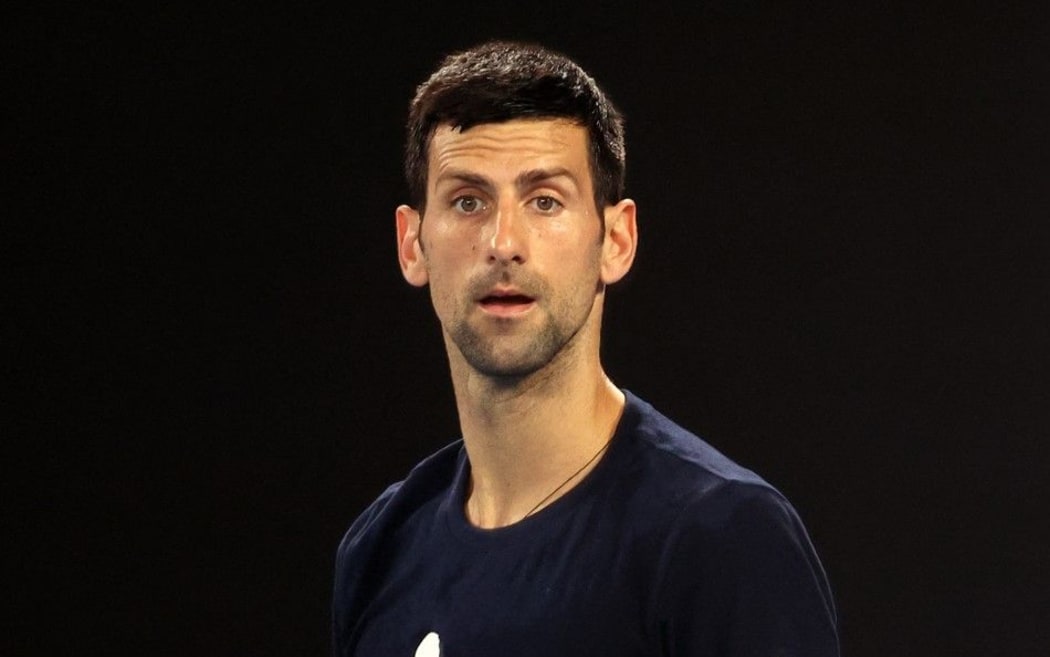 Novak Djokovic of Serbia attends a practice session ahead of the Australian Open tennis tournament in Melbourne on January 14, 2022. (Photo by MARTIN KEEP / AFP) /