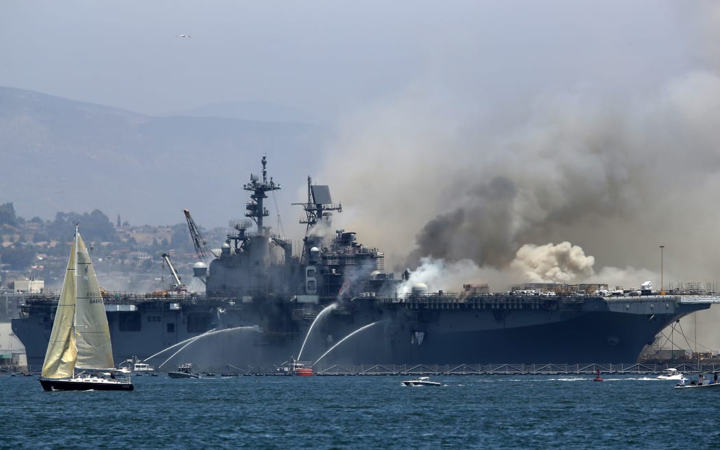 A fire burning on the USS Bonhomme Richard at Naval Base San Diego, California, 12 July 2020, California.