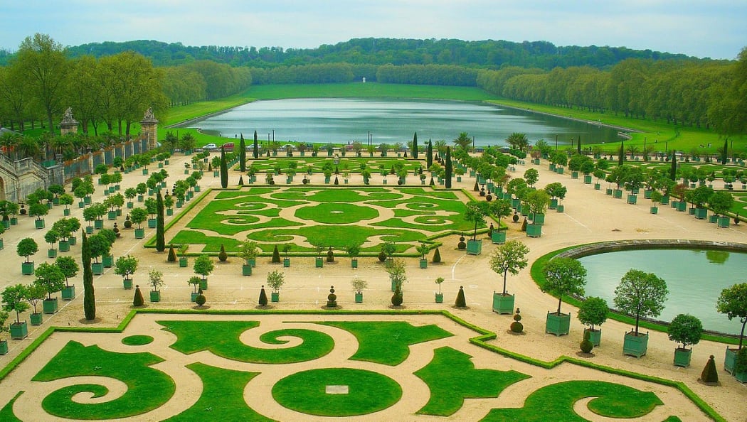 These decorative lawns in the grounds of the Palace of Versailles in France are an example of early lawns which used to be cut by hand.