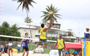Team Palau (yellow uniforms), the eventual gold medal winner, playing against Northern Mariana Islands in beach volleyball. Photo: Wilmer Joel.