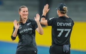 New Zealand's Rosemary Mair celebrates taking a wicket with captain Sophie Devine.