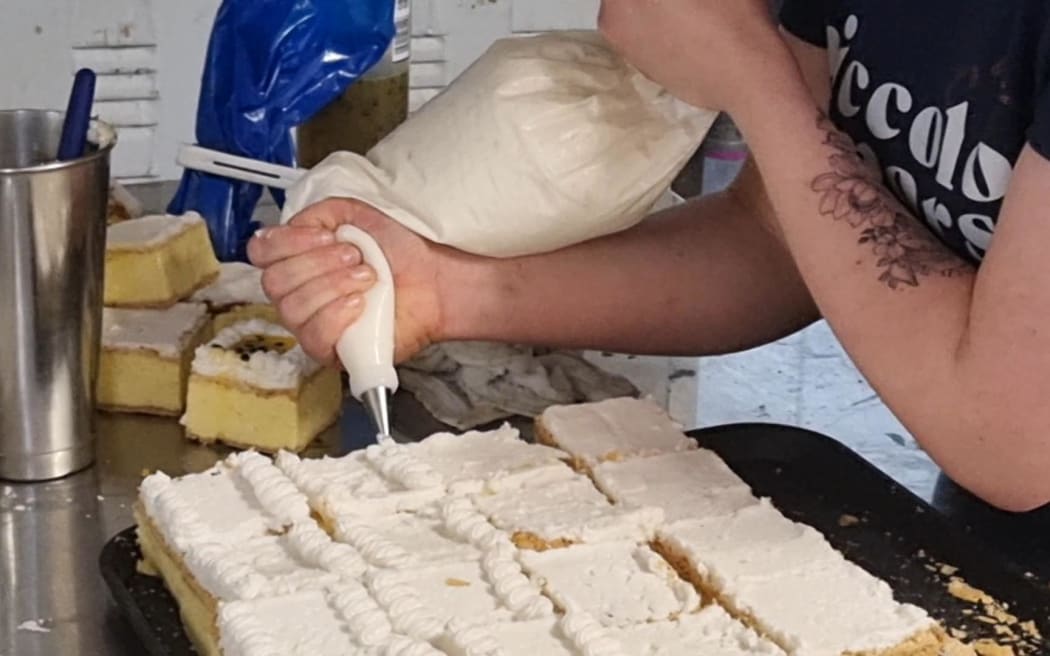 Each custard square has hand-pipe icing and a passionfruit filling.
