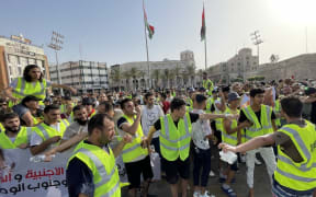 TRIPOLI, LIBYA - JULY 01: Young people stage a protest demanding the dissolution of the legislative and executive institutions in the country at Martyr's Square in Tripoli, Libya on July 01, 2022. Hazem Turkia / Anadolu Agency (Photo by Hazem Turkia / ANADOLU AGENCY / Anadolu Agency via AFP)