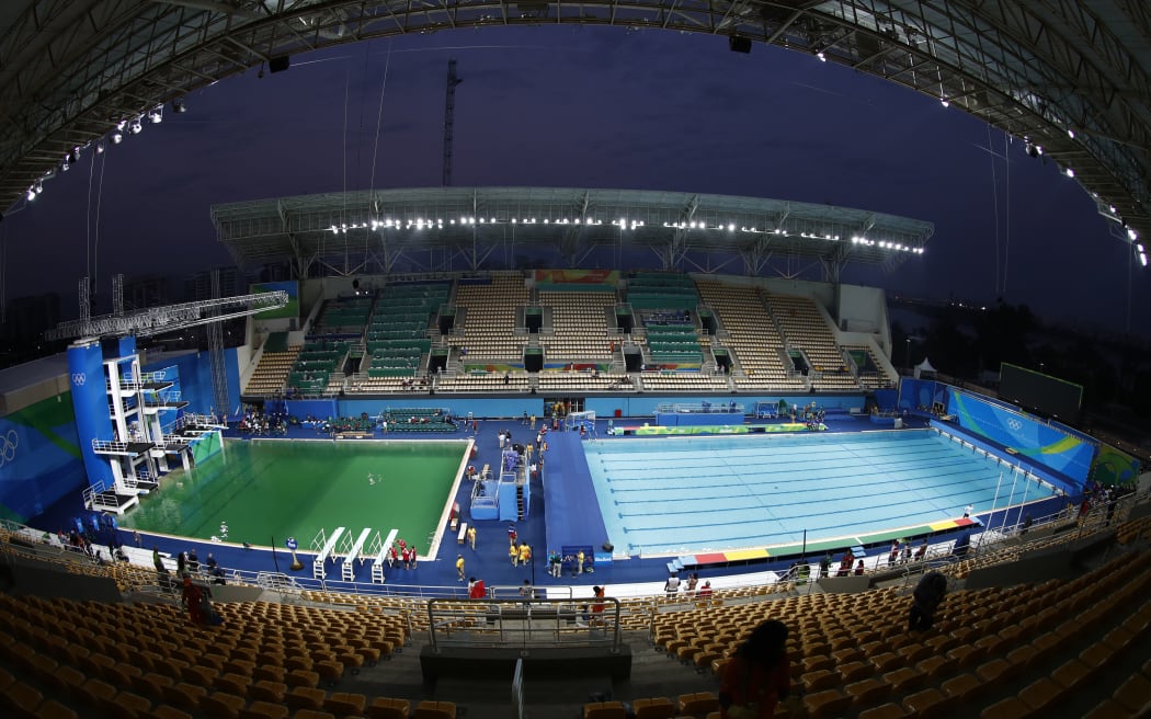 The diving pool at Maria Lenk Aquatics Stadium is a murky green before the Women's Synchronised 10m Platform Final at the Rio 2016 Olympic Games