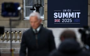 Members of the media work ahead of the UK-EU Summit at Lancaster House in London on May 19, 2025. UK Prime Minister Keir Starmer hosts European Union chiefs on Monday for a landmark summit designed to usher in a closer relationship between Britain and the bloc, five years after Brexit. (Photo by HENRY NICHOLLS / POOL / AFP)