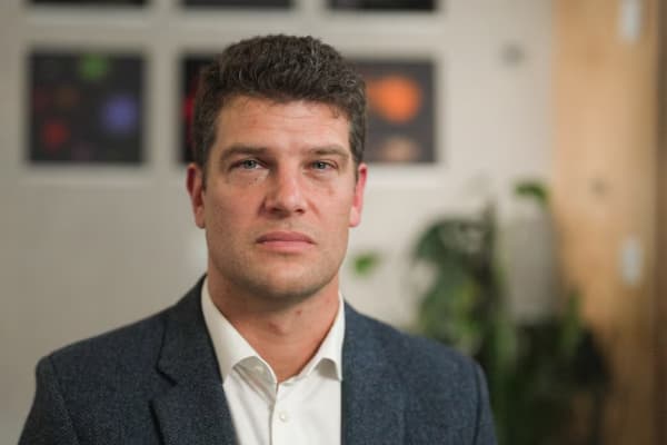 A headshot of Henry Fraser - an expert in artificial intelligence regulation.