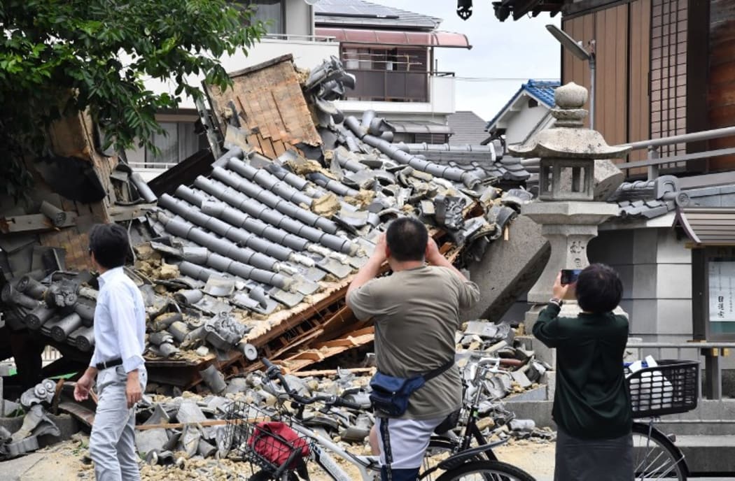 Myotokuji temple is destroyed by an earthquake registering a weak 6 on the Japanese seismic scale in Ibaraki City, the north side of Osaka Prefecture on June 18, 2018.