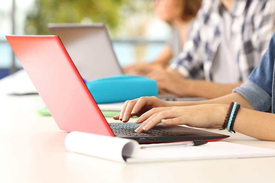 Students working at laptops