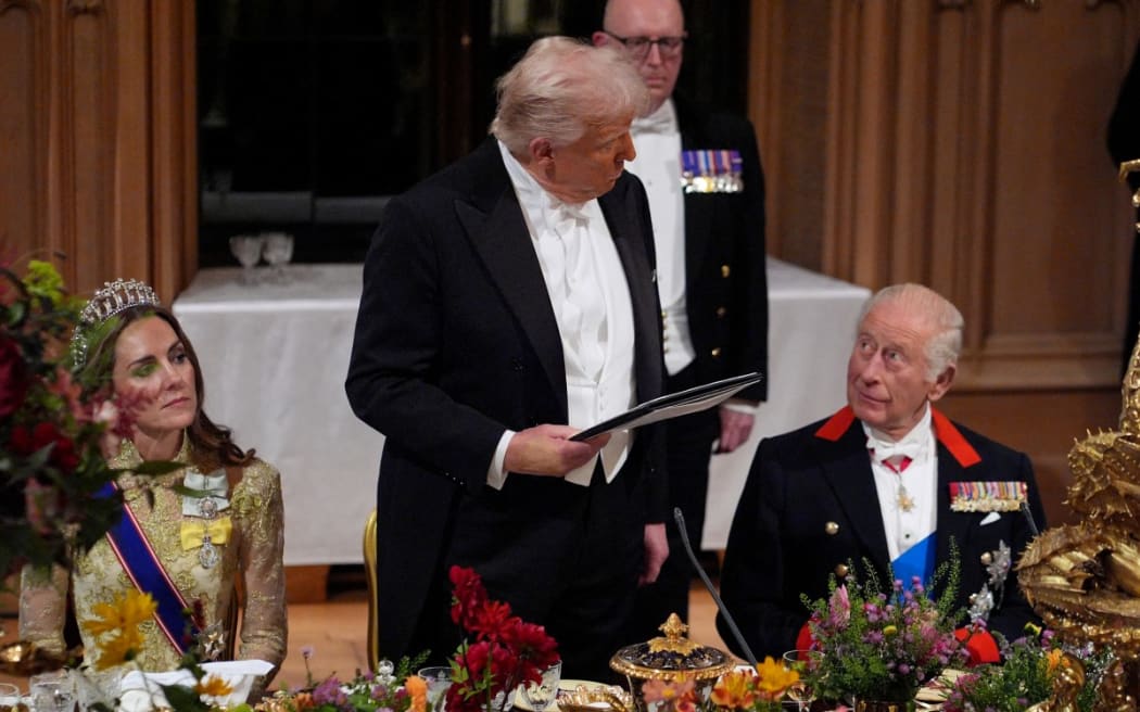 US President Donald Trump delivers a speech as Britain's King Charles III watches on during a State Banquet at Windsor Castle, in Windsor, on 17 September 2025