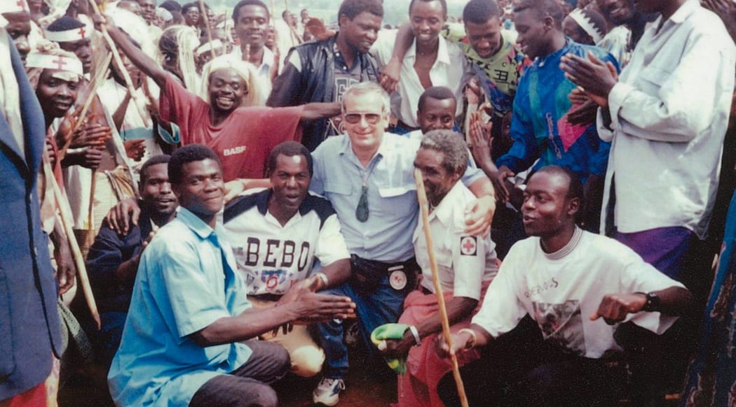 Bob Askew with new friends and a young Francois Byanama (in white, sitting first from the right) and others at the camp in Goma, DRC,1994