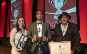 Quinn Morgan, centre, was announced as the winner at a gala dinner in New Plymouth, Taranaki.