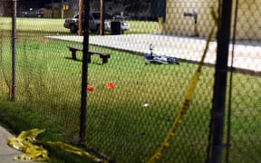 Evidence markers sit on the ground after a shooting at Bunny Friend Park in New Orleans, Louisiana, on 22 November 2015.