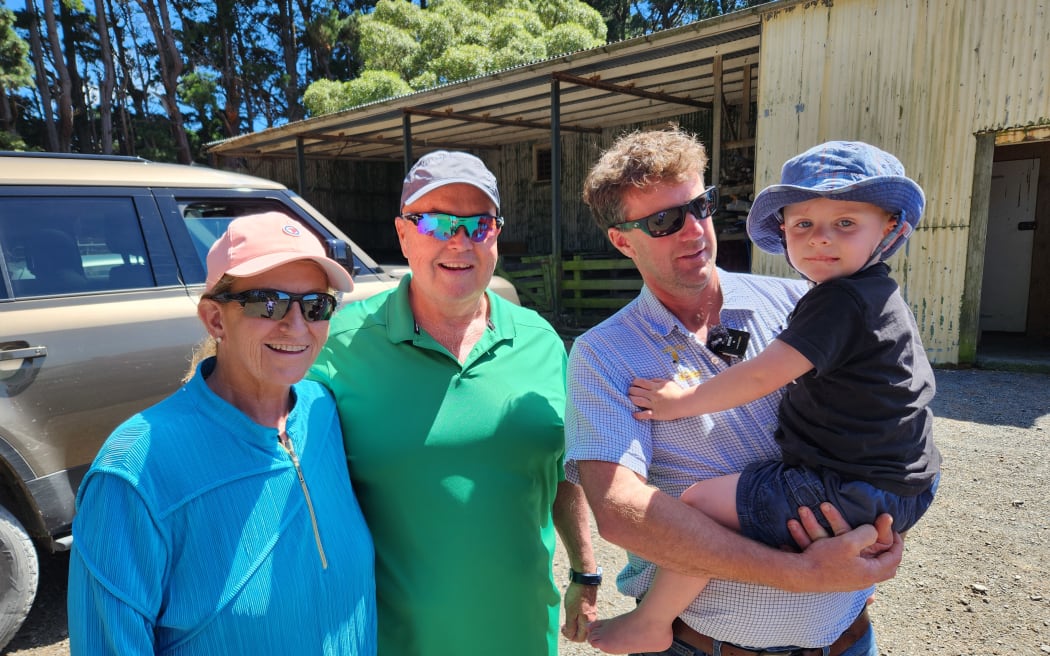Bradley Riggs and his son Bradley Junior with guests Paula and Monty Reed outside the woolshed