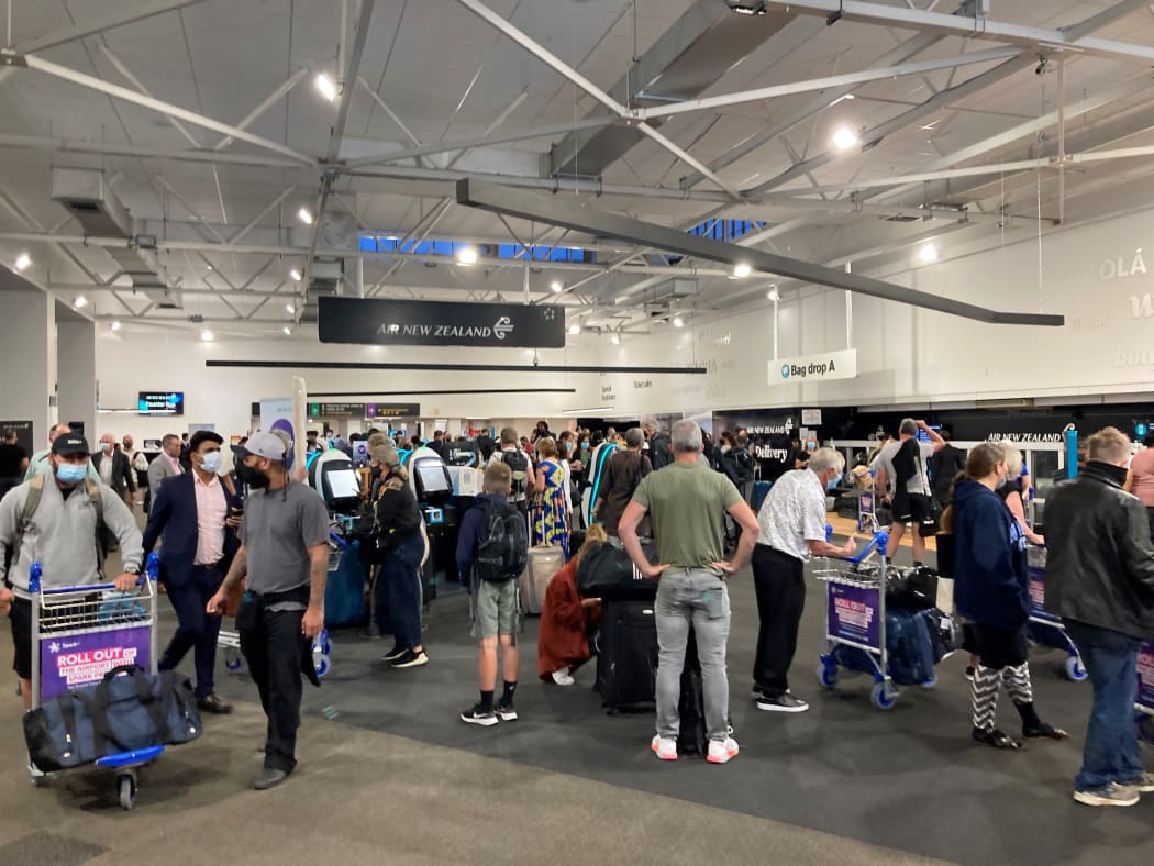 People checking in at Auckland Airport's domestic terminal.