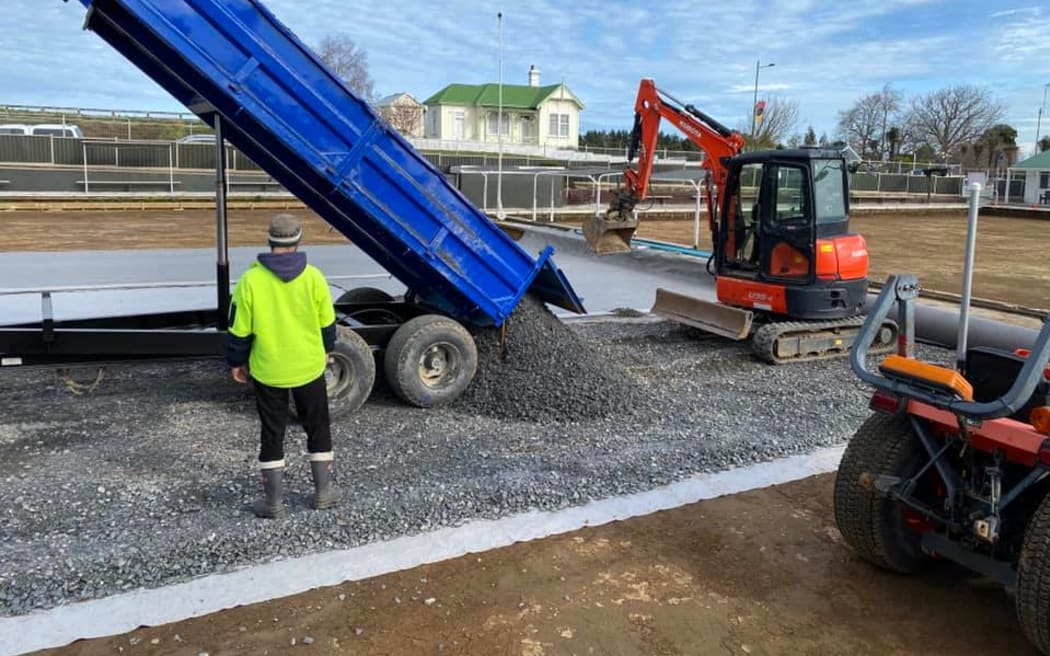 The metal is laid down for an even playing field.
