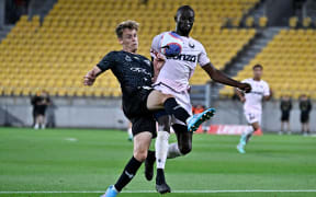 Jason Geria of the Victory and Oskar van Hattum of the Phoenix compete for the ball during the A-League - Wellington Phoenix v Melbourne Victory FC at Sky Stadium, Wellington, New Zealand on Friday 19 January 2024
Copyright photo: Masanori Udagawa /  www.photosport.nz