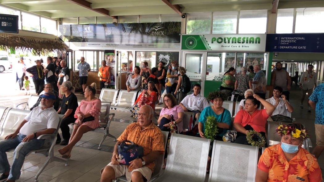 People waiting at the airport in Rarotonga on the first day of the travel bubble with New Zealand.